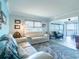 Bright living room with hardwood floors, modern furnishings, and an open view of the lanai at 8251 Brent St # 941, Port Richey, FL 34668