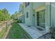 Exterior view of the backyard, with lawn, patio and sliding glass door at 8341 Shallow Creek Ct, New Port Richey, FL 34653