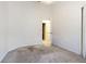 Spacious carpeted bedroom with a glimpse into an adjacent bathroom at 8341 Shallow Creek Ct, New Port Richey, FL 34653