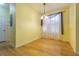 Cozy dining area featuring wood floors and natural light at 8341 Shallow Creek Ct, New Port Richey, FL 34653