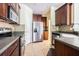 Bright kitchen featuring stainless steel appliances and tile flooring at 8341 Shallow Creek Ct, New Port Richey, FL 34653