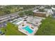 An aerial view of the condo complex showcasing the beautiful pool and grounds at 9945 47Th Ave N # 203, St Petersburg, FL 33708