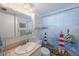 Bathroom with decorative shower curtain, and a modern sink and vanity for storage at 9945 47Th Ave N # 203, St Petersburg, FL 33708