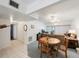 Open floorplan of the living room and adjacent kitchen and dining area at 9945 47Th Ave N # 203, St Petersburg, FL 33708
