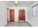 Bedroom featuring light gray carpet, white walls, and a unique vintage-style tallboy dresser at 1054 13Th S Ave, St Petersburg, FL 33705