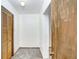 Hallway with neutral carpet and door at 1054 13Th S Ave, St Petersburg, FL 33705