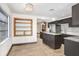 Bright kitchen with dark cabinets, an island, and stainless appliances at 1054 13Th S Ave, St Petersburg, FL 33705