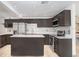 Modern kitchen featuring dark cabinets, light countertops and stainless steel appliances at 1054 13Th S Ave, St Petersburg, FL 33705