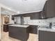 Modern kitchen featuring dark cabinets, light countertops and stainless steel appliances at 1054 13Th S Ave, St Petersburg, FL 33705