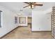 Open concept living room featuring wood look tile and light walls at 1054 13Th S Ave, St Petersburg, FL 33705