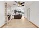 Open-concept living room featuring a stone fireplace and views into the kitchen at 1054 13Th S Ave, St Petersburg, FL 33705
