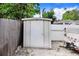 Exterior view of the metal shed with a door in the backyard at 1054 13Th S Ave, St Petersburg, FL 33705