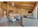 Cozy dining area with wooden walls, booth seating, tables, and warm lighting at 14800 Walsingham Rd # 301, Largo, FL 33774