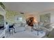 Spacious living room with comfortable seating and dedicated work area at 14800 Walsingham Rd # 301, Largo, FL 33774
