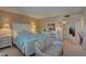 Serene main bedroom with a luxurious bed and access to the en suite bathroom at 14800 Walsingham Rd # 301, Largo, FL 33774