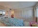 Bright bedroom featuring ample closet space and a pleasant sitting area at 14800 Walsingham Rd # 301, Largo, FL 33774