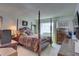 Classic bedroom with a four poster bed, dresser, and stylish decor at 14800 Walsingham Rd # 301, Largo, FL 33774