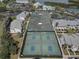 Aerial view of well-maintained tennis and pickleball courts within a residential community at 14800 Walsingham Rd # 301, Largo, FL 33774