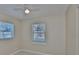 A simple bedroom with tile floors and a ceiling fan at 1601 24Th S St, St Petersburg, FL 33712