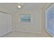 Neutral bedroom featuring tile floors, a closet, and natural light at 1601 24Th S St, St Petersburg, FL 33712