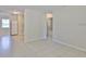 Open-concept living area leading to the kitchen featuring tile flooring at 1601 24Th S St, St Petersburg, FL 33712
