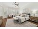 Serene bedroom with bay window, ceiling fan, and neutral color scheme at 1819 Bella Casa Ct, Tampa, FL 33618