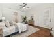 Comfortable bedroom with soft rug, dresser, and ensuite bathroom at 1819 Bella Casa Ct, Tampa, FL 33618