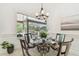 Bright breakfast nook with views of screened outdoor pool area through a large bay window at 1819 Bella Casa Ct, Tampa, FL 33618