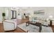 Inviting open-concept living area with views of the dining room and front entrance, featuring hardwood floors at 1819 Bella Casa Ct, Tampa, FL 33618