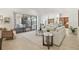 Open-concept living area with sliding doors to the outdoor entertainment area and seamless flow to the kitchen at 1819 Bella Casa Ct, Tampa, FL 33618
