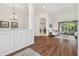 Bright living space featuring hardwood floors and an open concept design with views of the dining area at 1819 Bella Casa Ct, Tampa, FL 33618