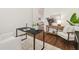 Stylish home office with modern desk, wood floors, and comfortable seating at 1819 Bella Casa Ct, Tampa, FL 33618