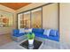 Cozy outdoor living area with stylish seating, coffee table, and views of the home's interior at 1819 Bella Casa Ct, Tampa, FL 33618