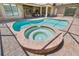Inviting backyard pool and spa provides a relaxing outdoor retreat in a screened enclosure at 1819 Bella Casa Ct, Tampa, FL 33618
