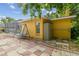 View of the side yard featuring a charming swing set, utility shed, and paved area at 23211 Lucerne Pl, Land O Lakes, FL 34639