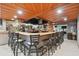 Spacious bar area with wood ceilings, wrap-around bar, and seating for many patrons at 23211 Lucerne Pl, Land O Lakes, FL 34639