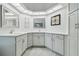 Bathroom featuring a double sink vanity, decorative wall art, and unique ceiling lights at 23211 Lucerne Pl, Land O Lakes, FL 34639