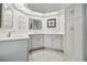 Spacious bathroom featuring a double sink vanity with ample storage and unique ceiling lights at 23211 Lucerne Pl, Land O Lakes, FL 34639