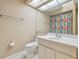 Bathroom featuring a single sink vanity, tile flooring, and bright lighting at 23211 Lucerne Pl, Land O Lakes, FL 34639