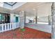Spacious ground floor with paver flooring, stone columns, and recreational space for outdoor living at 23211 Lucerne Pl, Land O Lakes, FL 34639