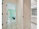 Hallway view leading to bedroom and bathroom with bright natural light at 23211 Lucerne Pl, Land O Lakes, FL 34639