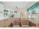 This modern kitchen features granite countertops, a stainless steel sink and appliances with tile flooring at 23211 Lucerne Pl, Land O Lakes, FL 34639