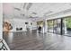 Large meeting room featuring lots of natural light, hard surface floors and a lovely stone fireplace at 23211 Lucerne Pl, Land O Lakes, FL 34639