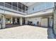 Covered parking area below elevated home featuring paver flooring at 23211 Lucerne Pl, Land O Lakes, FL 34639