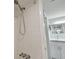 Bright bathroom featuring white subway tile shower and modern fixtures at 2400 Winding Creek Blvd # 2-201, Clearwater, FL 33761