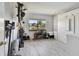 Bedroom featuring a large window, bike rack, and grey vinyl floors at 2400 Winding Creek Blvd # 2-201, Clearwater, FL 33761