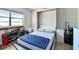 Bedroom featuring a large window, and built in bed at 2400 Winding Creek Blvd # 2-201, Clearwater, FL 33761