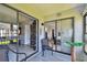 Comfortable lanai showing access to living and sleeping spaces at 2400 Winding Creek Blvd # 2-201, Clearwater, FL 33761