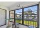 Cozy lanai featuring views of the landscaped grounds and neighboring buildings at 2400 Winding Creek Blvd # 2-201, Clearwater, FL 33761
