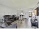Spacious living room featuring modern furnishings, a breakfast bar, and an inviting atmosphere at 2400 Winding Creek Blvd # 2-201, Clearwater, FL 33761